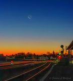 Crescent Moon Beyond The Rail Yard At Dawn 90D91977