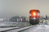 Westbound CPKC Freight Train Arriving At Night 90D95718