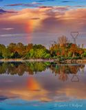 Partial Rainbow Reflected At Sunrise 90D154593