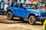 2023 Jeep Wrangler 4-door with the top off in Hydro Blue Pearl paint