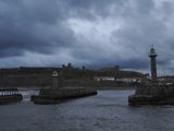 Whitby harbour lighthouse at dusk