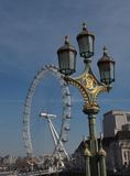 The London Eye ferris wheel with Victoria and Albert lamp post