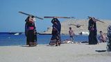  Bedouin women clollecting planks of destroyed boats after the flood of 1979