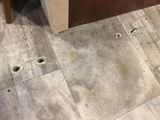 Holes in floor from seatbelt bracket