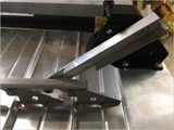 New arm assembly on lower vent