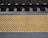 Step back behind the yellow line.