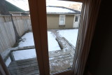 Kitchen looking into small patio room