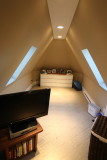 third floor suite other room with skylights