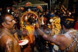 Performing rituals in preparation for the walk up Batu Caves