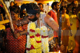Performing rituals in preparation for the walk up Batu Caves