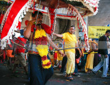 Carry the kavadi to the temple up the steps