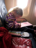 Kristina gets right to work on the plane
