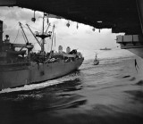 Loading stores from cargo ship on to USS Randoplh CVA 15