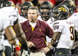 Arizona State Sun Devils Head Coach Todd Graham talks with his players during a timeout
