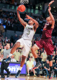 Georgia Tech F Marcus Georges-Hunt is challenged from behind by Virginia Tech F Jarell Eddie
