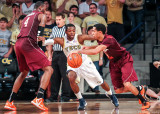 Jackets G Reed battles through the pick by Hokies F Cadarian Raines to stay with G Erick Green