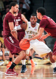 Georgia Tech G Reed fights through a Virginia Tech pick to stay with his man