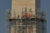 Workers repairing earthquake damage on the Washington Memorial (about 300 above the ground)