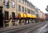 Judy in front of a cafe on a street in the Upper Town (Haute-Ville) section of Old Québec (Vieux-Québec).