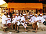 Men & boys gather inside a temple
