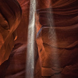 Sand falling in light shafts