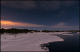 Nightphoto at Kaalasluspa. Lights from Kiruna City colors the sky