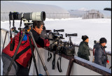 Old-fashioned Japanese photographer (panorama specialist?) waiting for cranes to act