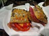 Prosciutto and tomato panino with sunflower seeded bread .. 4927