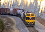 NS 117 in the shadows of the deep cut at Kings Mountain, with the rays of sun looking like lava on the walls