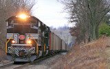 NYC 1066 brings 105 loads up the grade at Blackrock KY on a gloomy afternoon in West KY