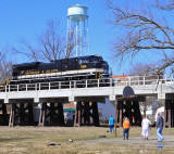 A family is playing basketball at Elmo Head park as NS I-23 crosses the new bridge 