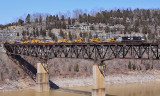 A short 9 car version of the weekly CAT move, NS 055, crosses the Cumberland River on a warm March afternoon