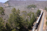 10,000 feet of loaded racks have the pair of GE's on train 275 workng hard to drag the train out of Burnside