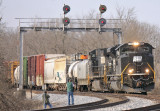 Southbound NS 117 with PC 1073 leading comes under the signal bridge at Georgetown KY