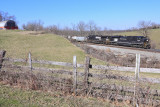 Penn Central 1073 brings NS 117 by the leaning barn at Blanchet KY
