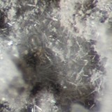 Mattheddleite, a rare lead nesosilicate, on 18 mm galena matrix, Whitwell Quarry, Whitwell, Derbyshire.