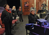 THE CHORUS WARMING UP BEFORE A PERFORMANCE