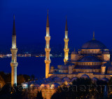Three lit minarets of the Blue Mosque at dusk on the Bosphorus Sultanahmet Istanbul Turkey