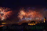 Republic Day fireworks over the Boshporus with lit Topkapi and Dolmabahce Palaces Istanbul Turkey