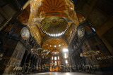 Ceiling domes in an empty Hagia Sophia Istanbul with chandeliers and wood roundels