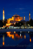 Lights on Hagia Sophia at dusk with reflections in fountain Istanbul Turkey