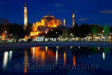 Lights on Hagia Sophia at twilight with reflections in fountain Istanbul Turkey