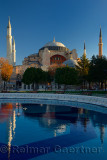 Early morning sun on the Hagia Sophia with reflection in fountain Istanbul Turkey