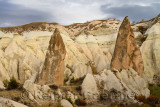 Red pointed Rocks among eroded yellow tuff in the Red Valley Cappadocia Turkey