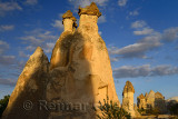 Fairy chimneys and shadows in golden light at sunset in Pasabag Monks Valley Cappadocia Turkey