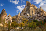 Fairy chimneys and ancient Uchisar Castle carved out of volcanic tuff Cappadocia Turkey