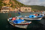 Village hamlet of Assos Iskele or Behram Turkey between sea and cliffs with boats hotels and restaurants
