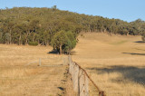 Boundary fence up hill