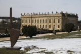 Sculpture and house