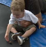 Jack helping a toad jump on a trampoline